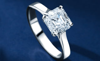 Royal Asscher Cut Diamond Ring with blue background