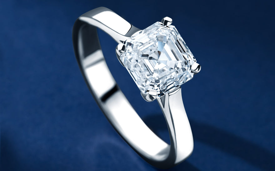 Royal Asscher Cut Diamond Ring with blue background